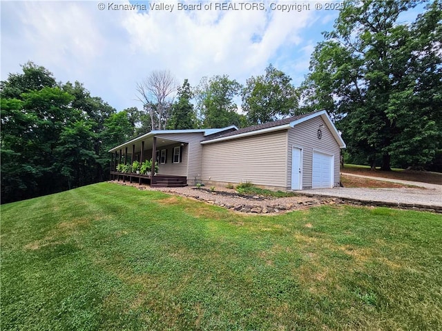 438 Tanglewood Dr, Point Pleasant, WV 25550 - view of home's exterior featuring an attached garage, a lawn, and driveway