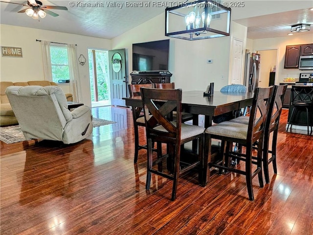 438 Tanglewood Dr, Point Pleasant, WV 25550 - dining room featuring dark wood-type flooring, a ceiling fan, lofted ceiling, and a chandelier