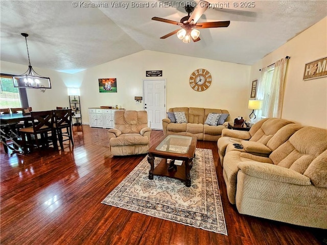 438 Tanglewood Dr, Point Pleasant, WV 25550 - living room featuring vaulted ceiling, wood finished floors, a ceiling fan, and a chandelier