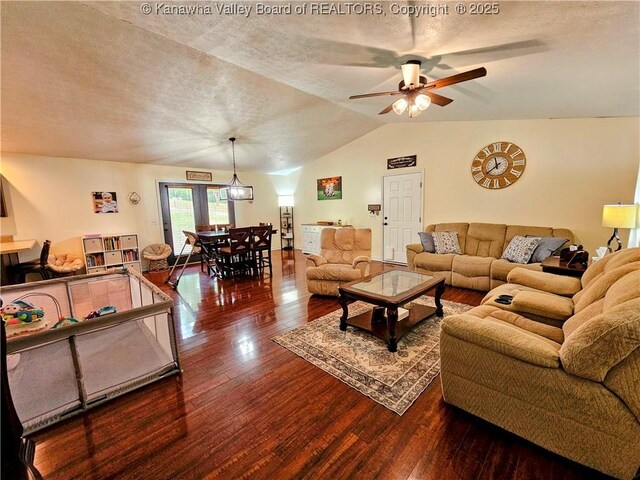 438 Tanglewood Dr, Point Pleasant, WV 25550 - living room with wood finished floors, vaulted ceiling, a ceiling fan, and a textured ceiling
