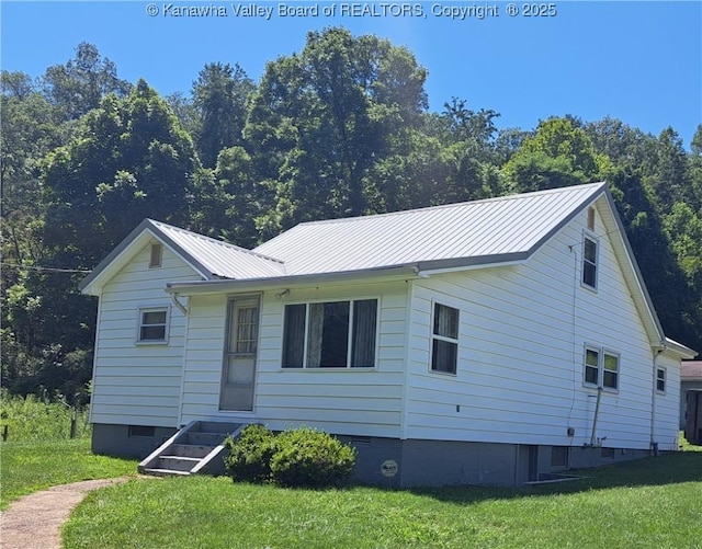 588 Saunders Creek Rd, Milton, WV 25541 - view of front of house with a front lawn, crawl space, a metal roof, and a standing seam roof