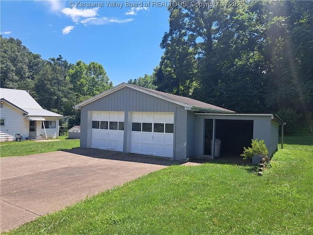 588 Saunders Creek Rd, Milton, WV 25541 - view of front of house with a front yard, an outbuilding, and concrete block siding