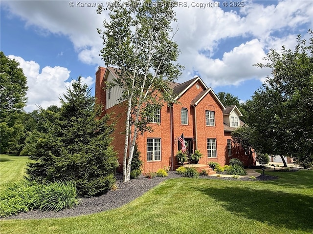 255 Stoney Brook Dr, Point Pleasant, WV 25550 - view of front of house with a front lawn, a chimney, and brick siding