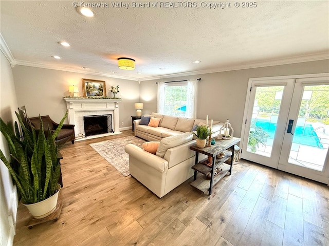 255 Stoney Brook Dr, Point Pleasant, WV 25550 - living room featuring french doors, a textured ceiling, light wood-style flooring, crown molding, and recessed lighting