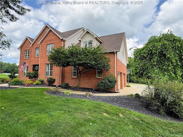 255 Stoney Brook Dr, Point Pleasant, WV 25550 - view of front of house featuring brick siding, a front yard, and driveway