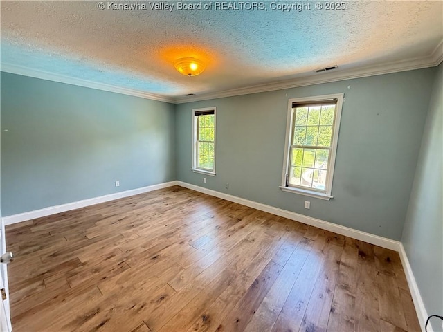 255 Stoney Brook Dr, Point Pleasant, WV 25550 - spare room with a textured ceiling, crown molding, and hardwood / wood-style flooring