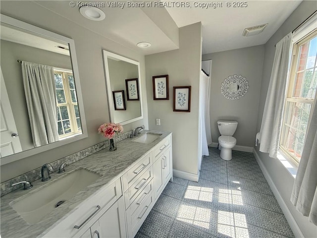 255 Stoney Brook Dr, Point Pleasant, WV 25550 - bathroom with double vanity and a shower with curtain