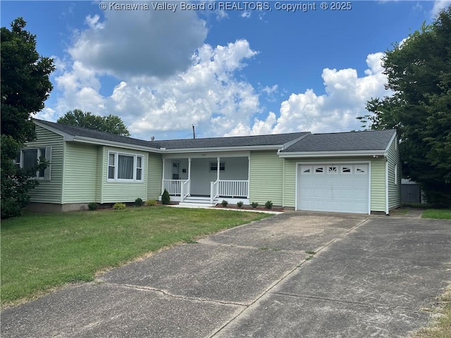 709 Mcintosh Ave, Ravenswood, WV 26164 - single story home featuring covered porch, an attached garage, concrete driveway, and a front lawn