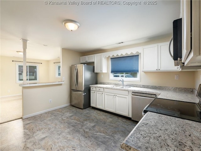 309 Kentucky Ave, Saint Albans, WV 25177 - kitchen featuring stainless steel appliances and white cabinets