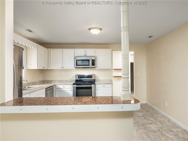 309 Kentucky Ave, Saint Albans, WV 25177 - kitchen featuring appliances with stainless steel finishes and white cabinetry