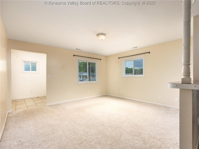 309 Kentucky Ave, Saint Albans, WV 25177 - tiled empty room featuring carpet and baseboards