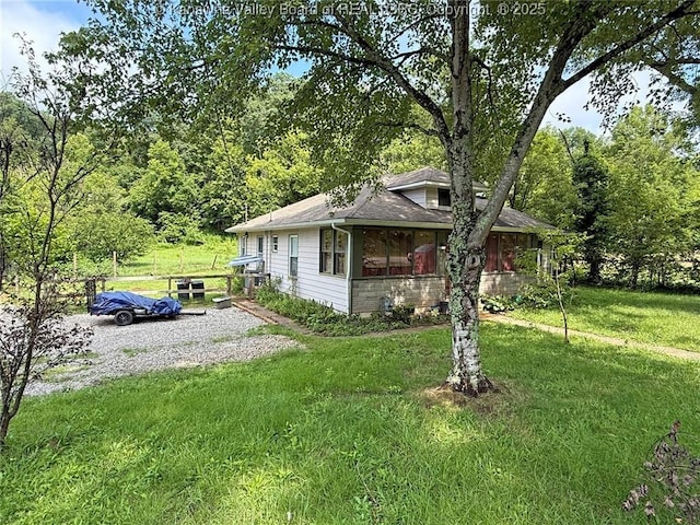 4261 Washington St W, Dunbar, WV 25313 - view of front of property featuring a front yard, a shingled roof, and a view of trees