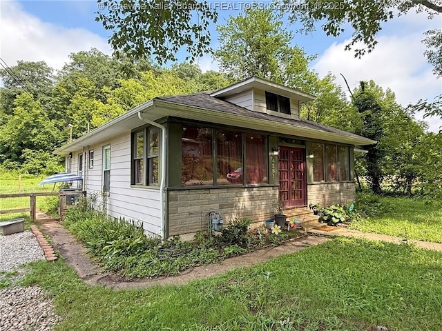4261 Washington St W, Dunbar, WV 25313 - bungalow-style house featuring entry steps, stone siding, and a shingled roof