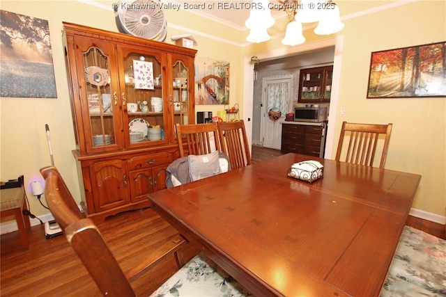 4261 Washington St W, Dunbar, WV 25313 - dining space featuring a chandelier, dark wood-style floors, and crown molding