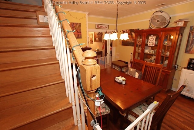 4261 Washington St W, Dunbar, WV 25313 - dining room with crown molding, a chandelier, wood finished floors, and stairway