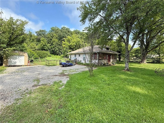 4261 Washington St W, Dunbar, WV 25313 - view of front of home featuring a garage and a storage unit