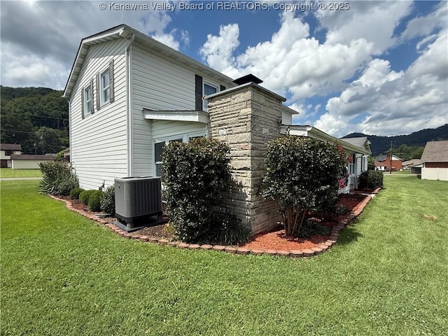 105 Sayer Cir, Logan, WV 25601 - view of property exterior with a lawn