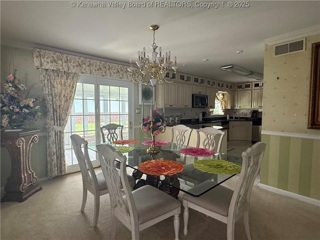 105 Sayer Cir, Logan, WV 25601 - dining room featuring a chandelier, light carpet, and wallpapered walls