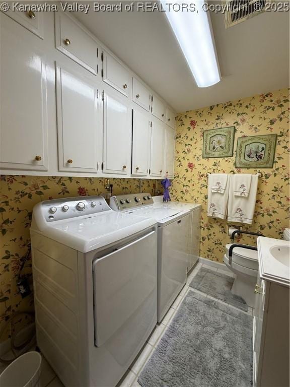 105 Sayer Cir, Logan, WV 25601 - laundry room with wallpapered walls, separate washer and dryer, and light tile patterned flooring
