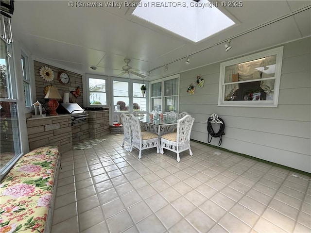 105 Sayer Cir, Logan, WV 25601 - sunroom featuring track lighting, ceiling fan, tile patterned floors, a skylight, and outdoor dining space