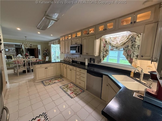 105 Sayer Cir, Logan, WV 25601 - kitchen with appliances with stainless steel finishes, glass insert cabinets, recessed lighting, decorative backsplash, and dark countertops