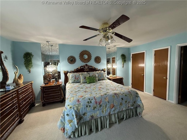 105 Sayer Cir, Logan, WV 25601 - bedroom featuring light colored carpet, a ceiling fan, and two closets