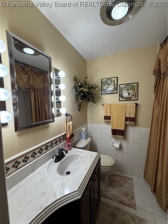 105 Sayer Cir, Logan, WV 25601 - full bathroom featuring tile walls, tile patterned flooring, vanity, and a wainscoted wall