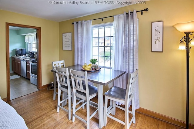 318 Monroe St, South Charleston, WV 25303 - dining space with light wood finished floors and plenty of natural light
