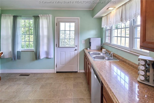 318 Monroe St, South Charleston, WV 25303 - kitchen featuring healthy amount of natural light, stainless steel dishwasher, brown cabinetry, ornamental molding, and light tile patterned flooring