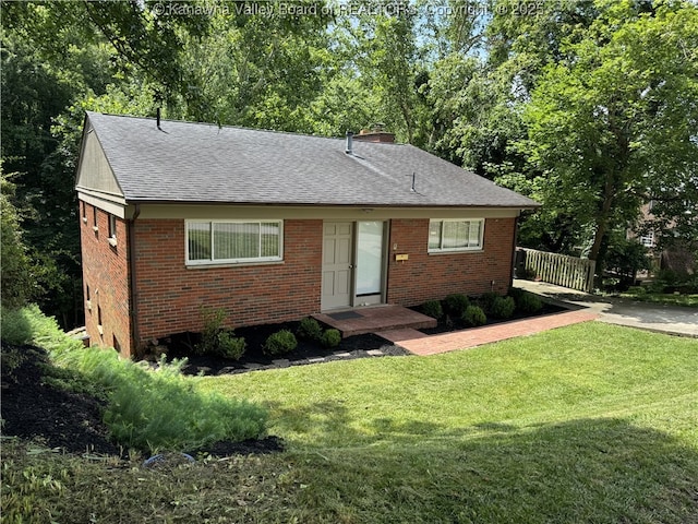 119 Swarthmore Ave, Charleston, WV 25302 - view of front facade with brick siding, a shingled roof, and a chimney