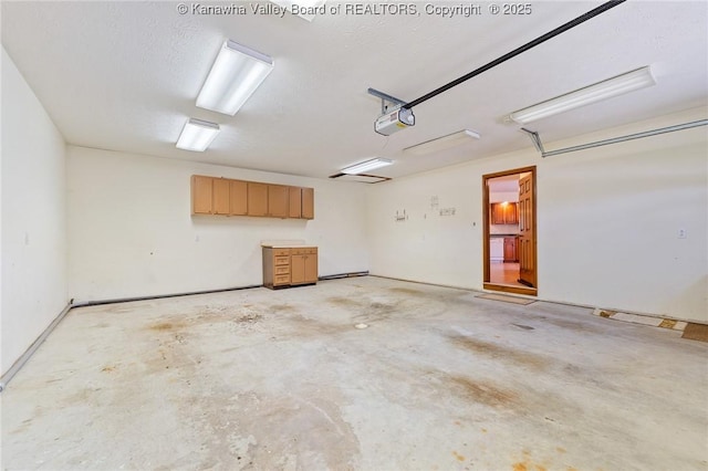 182 Summer Dr, Culloden, WV 25510 - garage featuring a garage door opener