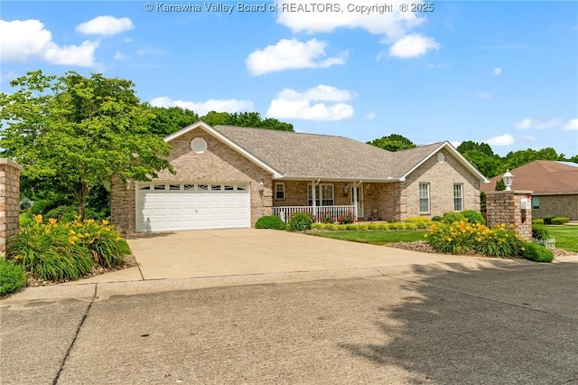 182 Summer Dr, Culloden, WV 25510 - ranch-style house featuring covered porch, brick siding, driveway, and a garage