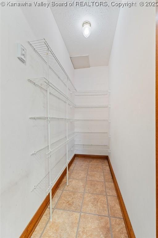 182 Summer Dr, Culloden, WV 25510 - spacious closet with light tile patterned floors
