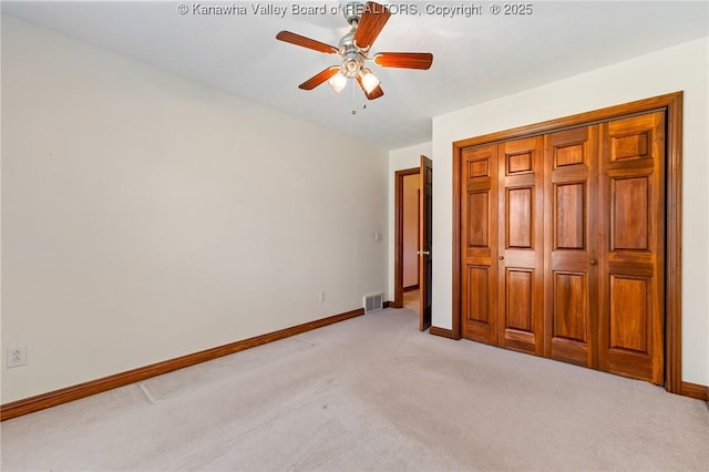 182 Summer Dr, Culloden, WV 25510 - unfurnished bedroom with light colored carpet, a closet, and ceiling fan