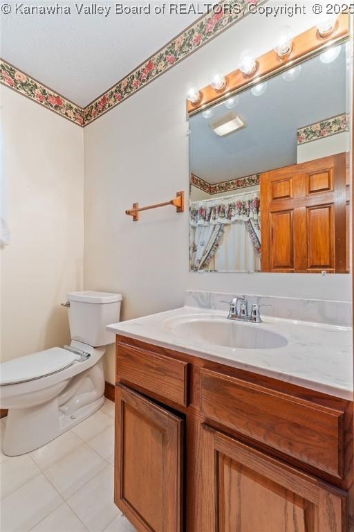 182 Summer Dr, Culloden, WV 25510 - full bath featuring tile patterned floors and vanity