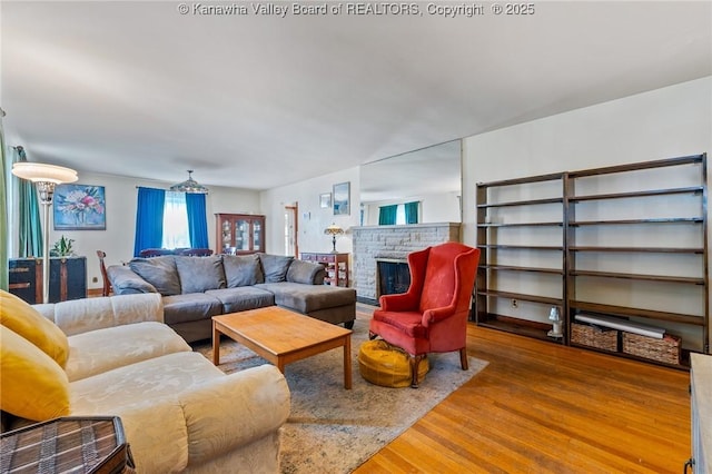 51 Roland Park Dr, Huntington, WV 25705 - living room featuring wood finished floors and a fireplace
