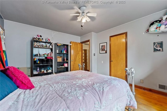 51 Roland Park Dr, Huntington, WV 25705 - bedroom with wood finished floors and ceiling fan