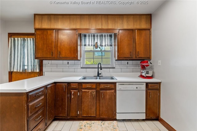 51 Roland Park Dr, Huntington, WV 25705 - kitchen with dishwasher, backsplash, and light countertops