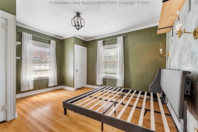 887 Poplar Rd, Charleston, WV 25302 - bedroom featuring multiple windows, wood finished floors, ornamental molding, and a chandelier