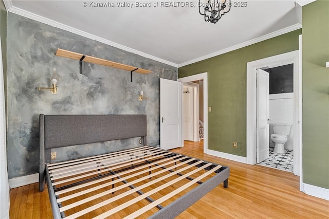 887 Poplar Rd, Charleston, WV 25302 - unfurnished bedroom with wood finished floors, crown molding, and ensuite bathroom