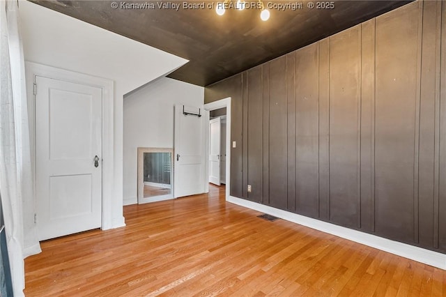 887 Poplar Rd, Charleston, WV 25302 - empty room with wood finished floors and baseboards