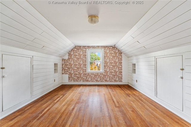 887 Poplar Rd, Charleston, WV 25302 - additional living space featuring built in features, hardwood / wood-style flooring, wooden walls, and lofted ceiling