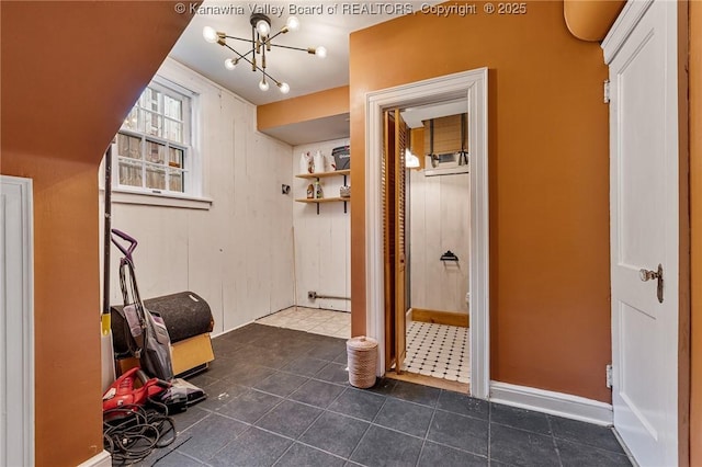 887 Poplar Rd, Charleston, WV 25302 - hall with a chandelier and dark tile patterned flooring