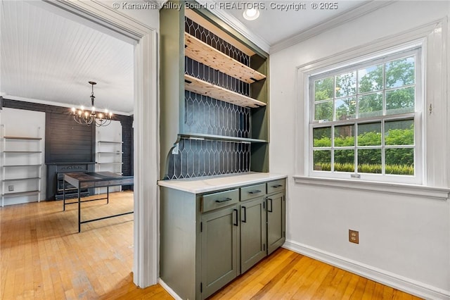 887 Poplar Rd, Charleston, WV 25302 - bar area featuring ornamental molding, light wood-style floors, and a chandelier