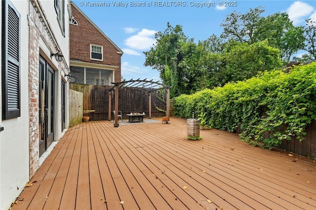 887 Poplar Rd, Charleston, WV 25302 - deck with a fire pit, a pergola, and a fenced backyard
