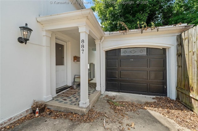 887 Poplar Rd, Charleston, WV 25302 - property entrance featuring stucco siding and an attached garage