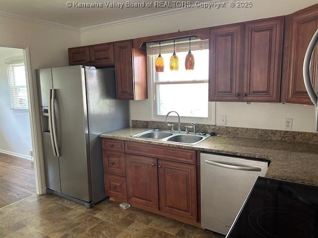 3503 Virginia Ave SE, Charleston, WV 25304 - kitchen with stainless steel appliances, crown molding, and decorative light fixtures
