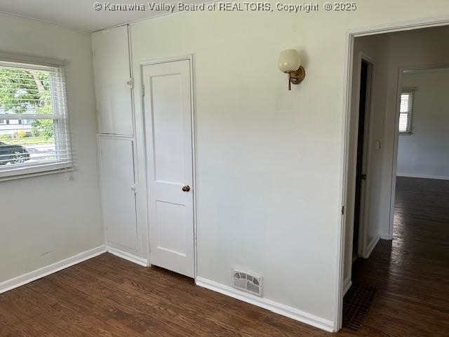 3503 Virginia Ave SE, Charleston, WV 25304 - unfurnished bedroom with dark wood-type flooring and baseboards