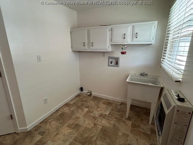 3503 Virginia Ave SE, Charleston, WV 25304 - laundry room featuring washer hookup, stone finish floors, heating unit, and cabinet space