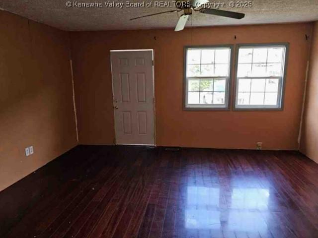 120 Rainbow Cir, Madison, WV 25130 - empty room featuring ceiling fan, wood finished floors, and a textured ceiling